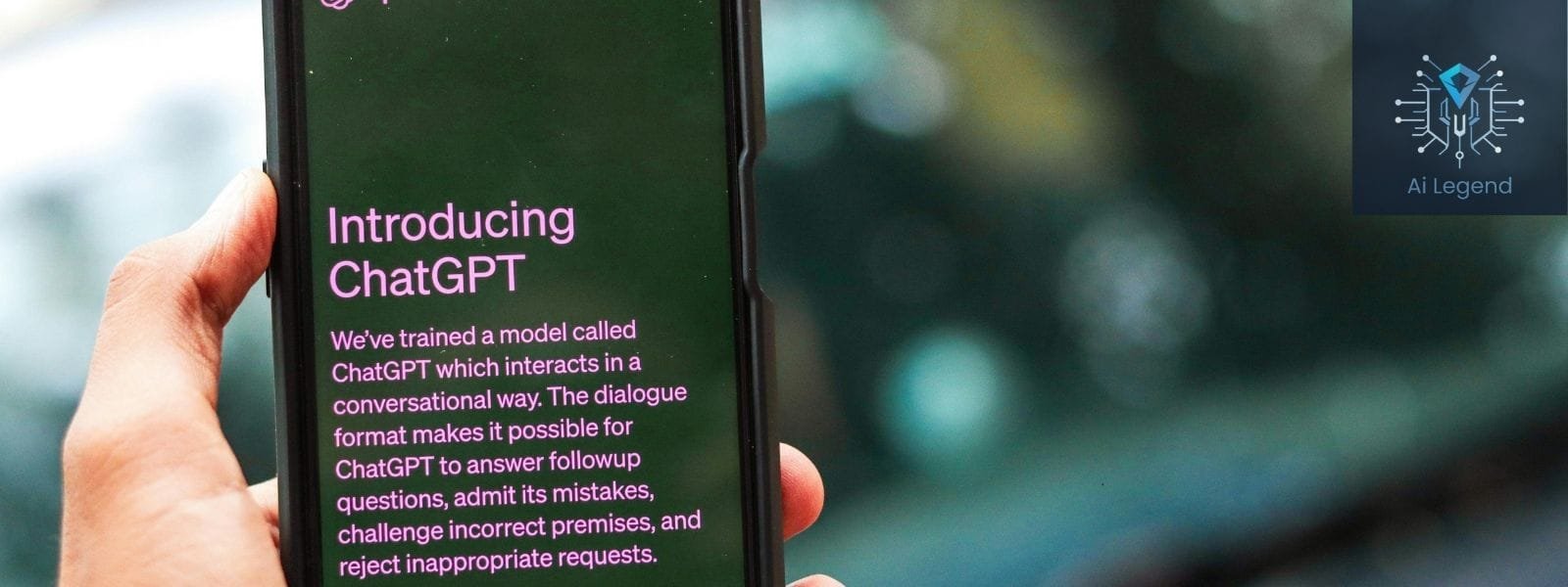 A person holding a smartphone displaying 'Introducing ChatGPT' with AI-powered conversational capabilities. AI Legend branding is visible in the corner.
